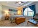 Comfortable main bedroom features a tray ceiling, ceiling fan, and plush carpet at 109 Kenny Blvd, Haines City, FL 33844