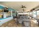 Outdoor bar with dining space, TVs, and fans provides the perfect spot for enjoying poolside refreshments at 109 Kenny Blvd, Haines City, FL 33844