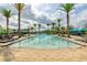Resort-style pool with palm trees, lounge chairs, and cabanas for relaxation at 109 Kenny Blvd, Haines City, FL 33844