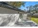 Backyard view showcasing the deck, backyard, landscaping and the house's exterior at 11572 Se 60Th Ave, Belleview, FL 34420