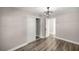 Bedroom featuring modern flooring, contemporary ceiling fan, and ample closet space for storage at 11572 Se 60Th Ave, Belleview, FL 34420