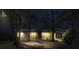 Night-time exterior showcases this single Gathering home's welcoming curb appeal with warm light shining through windows at 11572 Se 60Th Ave, Belleview, FL 34420
