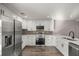 Spacious kitchen featuring modern stainless steel appliances, ample cabinetry, and a sleek design at 11572 Se 60Th Ave, Belleview, FL 34420