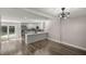 Open layout kitchen with stainless steel appliances, an island, and an adjacent dining area at 11572 Se 60Th Ave, Belleview, FL 34420