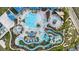 An aerial view showcasing a resort-style community pool, waterslides, splash pads, and a lazy river at 1221 Aloha Blvd, Davenport, FL 33897