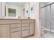 Bathroom featuring a double sink vanity and tiled glass door shower at 1221 Aloha Blvd, Davenport, FL 33897