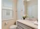 Cozy bathroom featuring a window and neutral decor at 1221 Aloha Blvd, Davenport, FL 33897