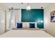 Stylish bedroom featuring a teal accent wall, pendant lights and modern decor at 1221 Aloha Blvd, Davenport, FL 33897