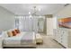 Bright bedroom featuring a comfortable bed, stylish lighting, and ample closet space at 1221 Aloha Blvd, Davenport, FL 33897