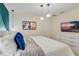 Bright bedroom with modern lighting, a TV, and white dresser at 1221 Aloha Blvd, Davenport, FL 33897