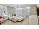 Stylish bedroom with modern lighting, luxurious bedding, and decorative mirrors at 1221 Aloha Blvd, Davenport, FL 33897
