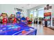 Spacious game room with many arcade games and a bright window at 1221 Aloha Blvd, Davenport, FL 33897
