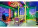 Unique Mario-themed game room with a foosball table, gaming chairs, and vibrant decor at 1221 Aloha Blvd, Davenport, FL 33897