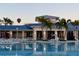 Community pool and clubhouse featuring a beautiful pool, restaurant and lounge area for residents and guests at 1221 Aloha Blvd, Davenport, FL 33897