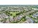 Aerial view showcases the neighborhood layout and proximity to green spaces and community amenities at 12691 Calderdale Ave, Windermere, FL 34786