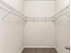 Walk-in closet featuring wire shelving and carpet flooring at 12691 Calderdale Ave, Windermere, FL 34786