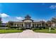 Exterior shot of the community clubhouse featuring manicured landscaping and a welcoming entrance at 12691 Calderdale Ave, Windermere, FL 34786