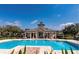 Community pool area, perfect for relaxation and recreation on a sunny day at 12691 Calderdale Ave, Windermere, FL 34786