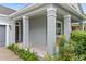 Covered front porch with columns and landscaping at 12691 Calderdale Ave, Windermere, FL 34786