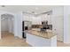 Spacious kitchen features stainless appliances, granite countertops, and an island with a sink at 12691 Calderdale Ave, Windermere, FL 34786