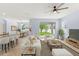 Cozy living room with dining area, featuring a neutral color palette and access to outdoor views at 12691 Calderdale Ave, Windermere, FL 34786