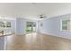 Bright and airy living space with tile floors, ceiling fan, and a view of the backyard at 12691 Calderdale Ave, Windermere, FL 34786