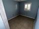 A bedroom with tiled flooring, a window with blinds, and painted walls, awaiting your personal touch at 1420 Bethesda St, Apopka, FL 32703