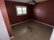 A bedroom with tiled flooring, a window with blinds, and painted walls, awaiting your personal touch at 1420 Bethesda St, Apopka, FL 32703