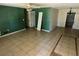 Spacious living room with neutral tile floors and a ceiling fan at 1420 Bethesda St, Apopka, FL 32703
