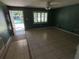 A welcoming living room bathed in natural light from the window next to the front door at 1420 Bethesda St, Apopka, FL 32703