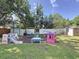 Spacious backyard featuring a playset, swing set, and climbing dome for outdoor fun at 2114 Mount Vernon St, Orlando, FL 32803
