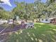 Well-maintained backyard with a playset, shed, and plenty of room for outdoor entertaining at 2114 Mount Vernon St, Orlando, FL 32803