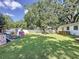 Expansive backyard boasting mature trees, a playset, and plenty of space for recreation at 2114 Mount Vernon St, Orlando, FL 32803