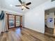 Bedroom with wooden floors, recessed lighting, and sliding door to the outside at 2114 Mount Vernon St, Orlando, FL 32803