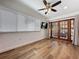 Bedroom featuring a ceiling fan, television, and sliding glass doors to an outdoor space at 2114 Mount Vernon St, Orlando, FL 32803