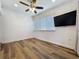 Simple bedroom with hardwood floors, a ceiling fan, and ample natural light at 2114 Mount Vernon St, Orlando, FL 32803