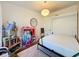 Bright bedroom with hardwood floors, modern light fixture, and a unique Murphy bed at 2114 Mount Vernon St, Orlando, FL 32803