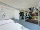 Covered carport with seating area, white exterior, and modern fixtures at 2114 Mount Vernon St, Orlando, FL 32803