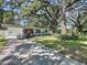 Charming single-story home boasting a lush green lawn and a cozy, shaded front entrance at 2114 Mount Vernon St, Orlando, FL 32803