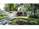 Charming single-story home with a well-manicured lawn, modern design, and inviting curb appeal at 2114 Mount Vernon St, Orlando, FL 32803