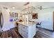 Spacious kitchen with modern light fixture, updated appliances, and an adjacent dining area at 2114 Mount Vernon St, Orlando, FL 32803