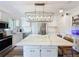 Bright kitchen featuring a center island, stainless steel appliances, and white cabinetry at 2114 Mount Vernon St, Orlando, FL 32803