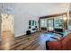 Open-concept living room with modern wallpaper and luxury vinyl flooring at 2114 Mount Vernon St, Orlando, FL 32803