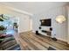 Stylish living room featuring modern decor, hardwood floors, and ample natural light, great for entertaining at 2114 Mount Vernon St, Orlando, FL 32803