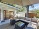 Covered patio with comfortable seating, perfect for outdoor entertaining with easy access to the yard at 2114 Mount Vernon St, Orlando, FL 32803