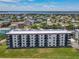 Aerial view shows the condo with balconies and ocean views at 3100 Ocean Shore Blvd # 4030, Ormond Beach, FL 32176