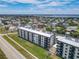 Aerial view of the condo building in a residential neighborhood at 3100 Ocean Shore Blvd # 4030, Ormond Beach, FL 32176