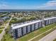 Scenic aerial view of a beachfront condo building near a beautiful blue body of water at 3100 Ocean Shore Blvd # 4030, Ormond Beach, FL 32176