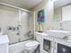 Clean bathroom featuring a shower with sliding glass door, a modern vanity, and sleek fixtures at 3100 Ocean Shore Blvd # 4030, Ormond Beach, FL 32176