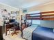 Inviting bedroom featuring cozy bunk beds, a desk, and decor at 3100 Ocean Shore Blvd # 4030, Ormond Beach, FL 32176